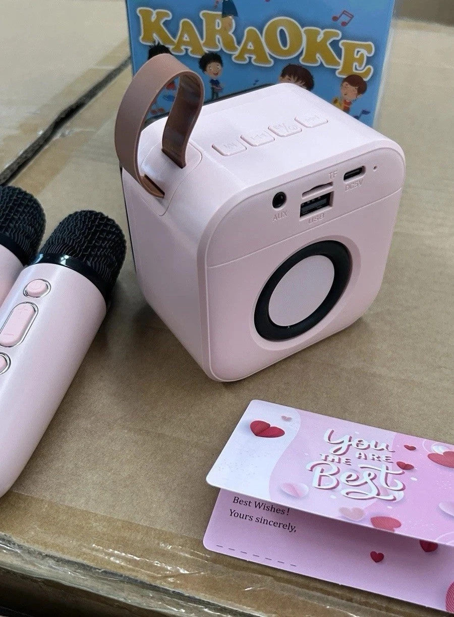 Karaoke Bambini 2 Microfoni Senza Fili Luci LED Cambio Voce Rosa USB 2600mAh 8cm